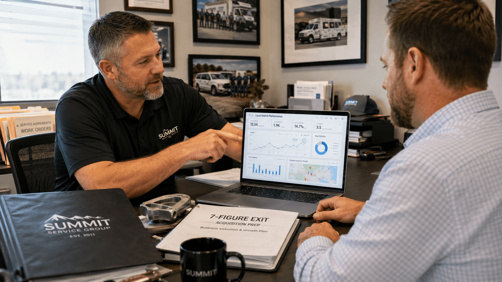 Image of a technician presenting to another man for the blog, How to Scale Your Trade Business Visibility for a 7-Figure Exit
